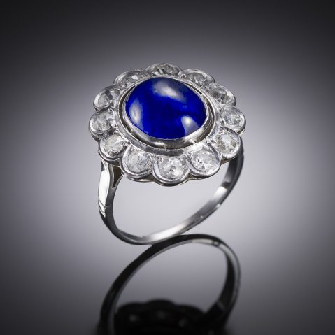 Art Deco unheated Burmese cabochon sapphire (5.89 carats, laboratory certificate) and diamond ring